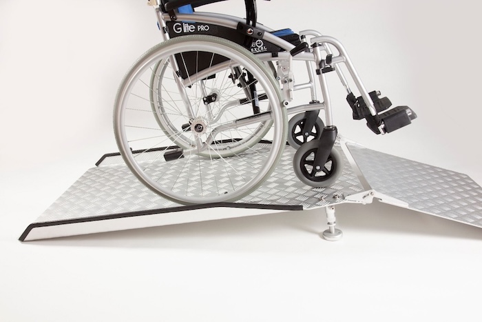 Wheelchair ramp going up and over bridge threshold ramp Wheelchair ramp going up and over bridge threshold ramp