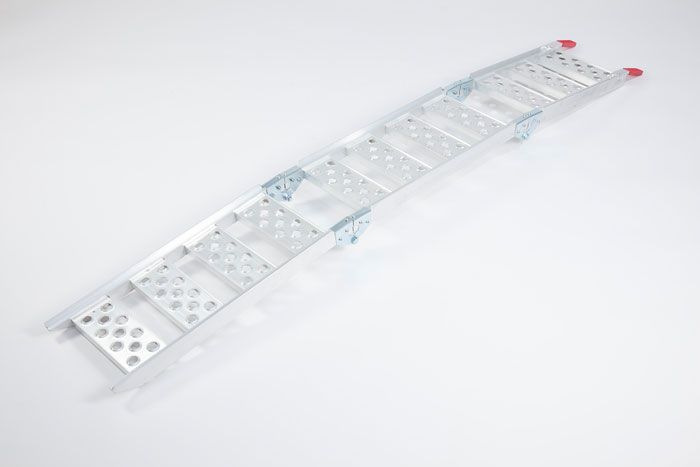 Curved tri-fold ramp laying on the ground