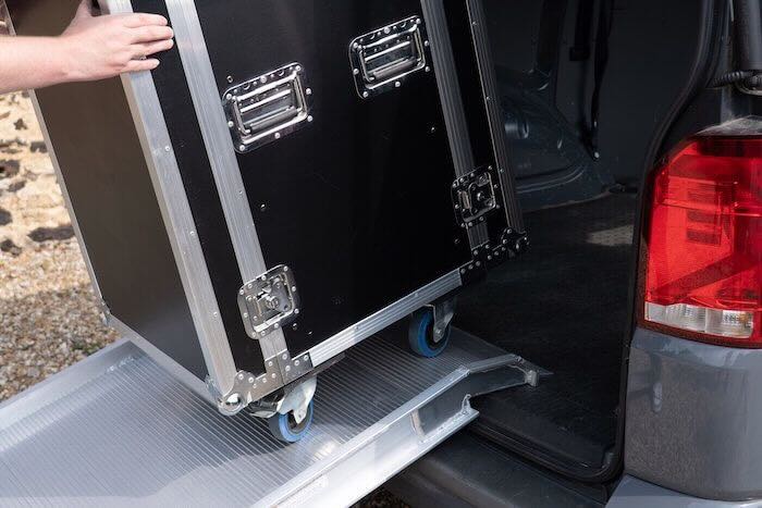 Flight case going up van ramp into van 