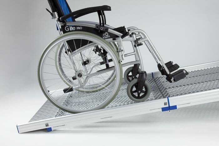 Wheelchair going up Anyramp Wheelchair going up Anyramp